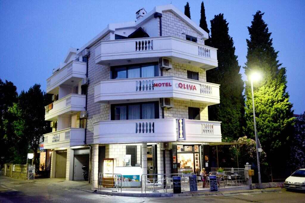 Hotel Sanja former Oliva building in Budva, Montenegro at dusk